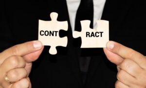 Man and woman hand holding jigsaw puzzles, business contract dispute resolution