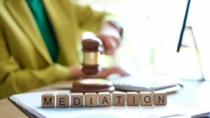 The word "mediation" displayed on cubes, representing the dispute resolution process in litigation. This reflects the procedure for addressing family conflicts.






